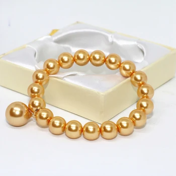 Bohemia estilo de oro amarillo de imitación de mar del sur shell perlas redondas perlas de 10mm brazalete de las mujeres de la cuerda elástica de la joyería de 7,5 pulgadas B1708